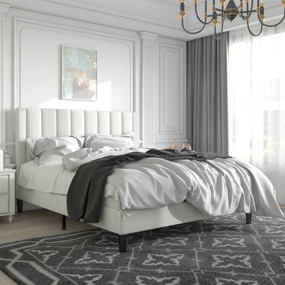 Luxury full size bed, chandelier, and decorative elements.
