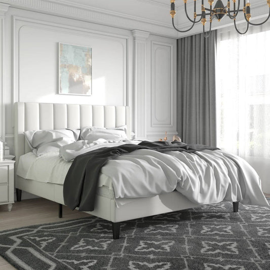 Luxury full size bed, chandelier, and decorative elements.