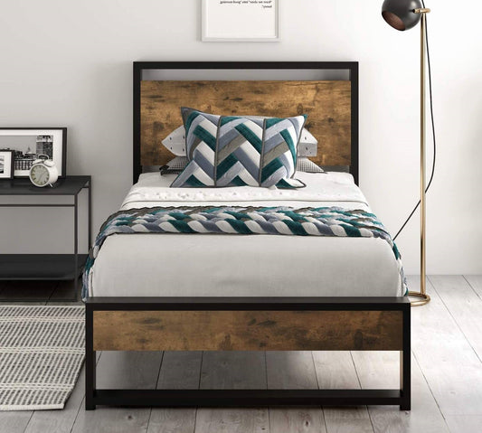 Bedroom with a metal and wooden bed frame, white bedding, and decorative pillows.