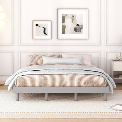 Gray bed frame with striped bedding in a bedroom setting.