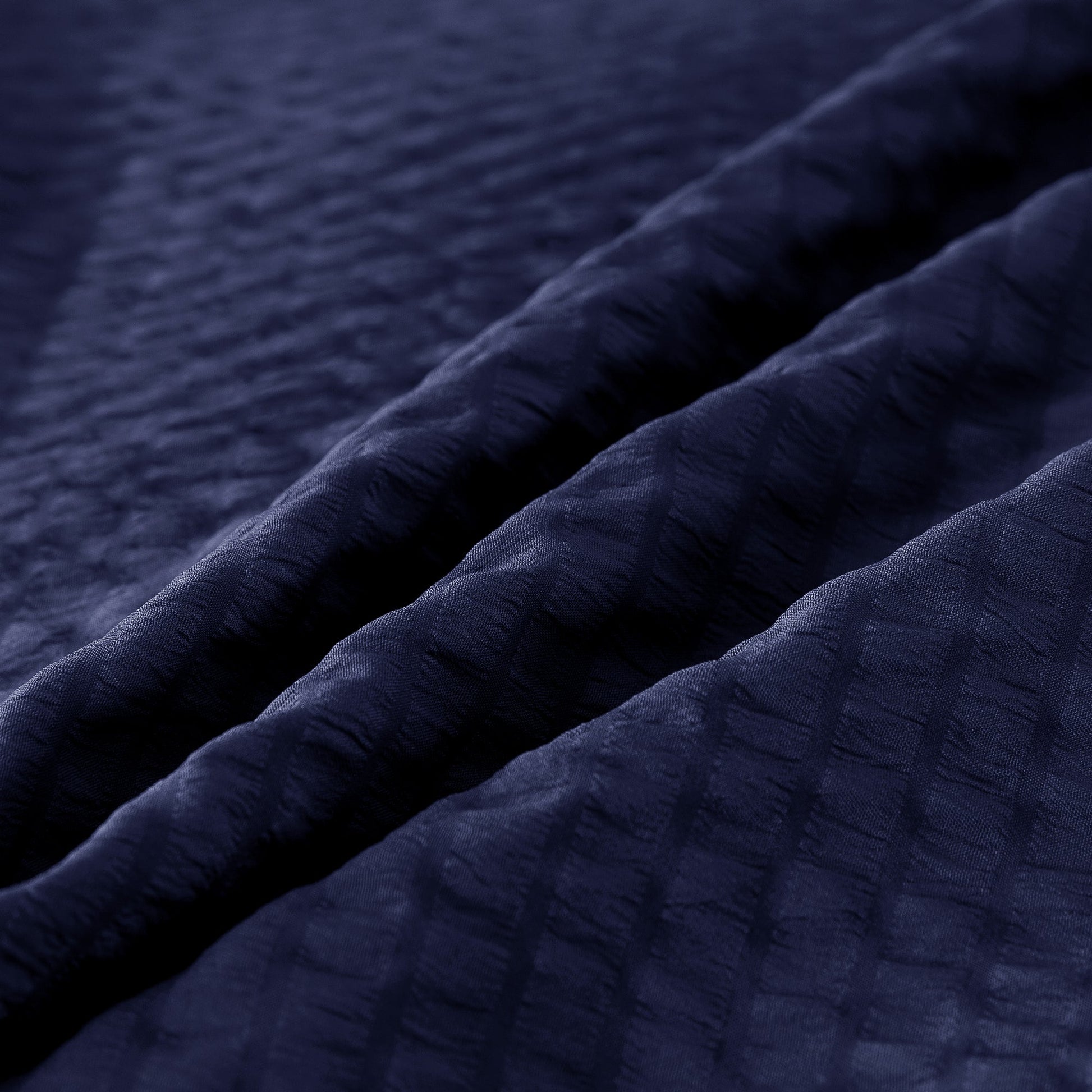 Close-up of textured navy blue fabric