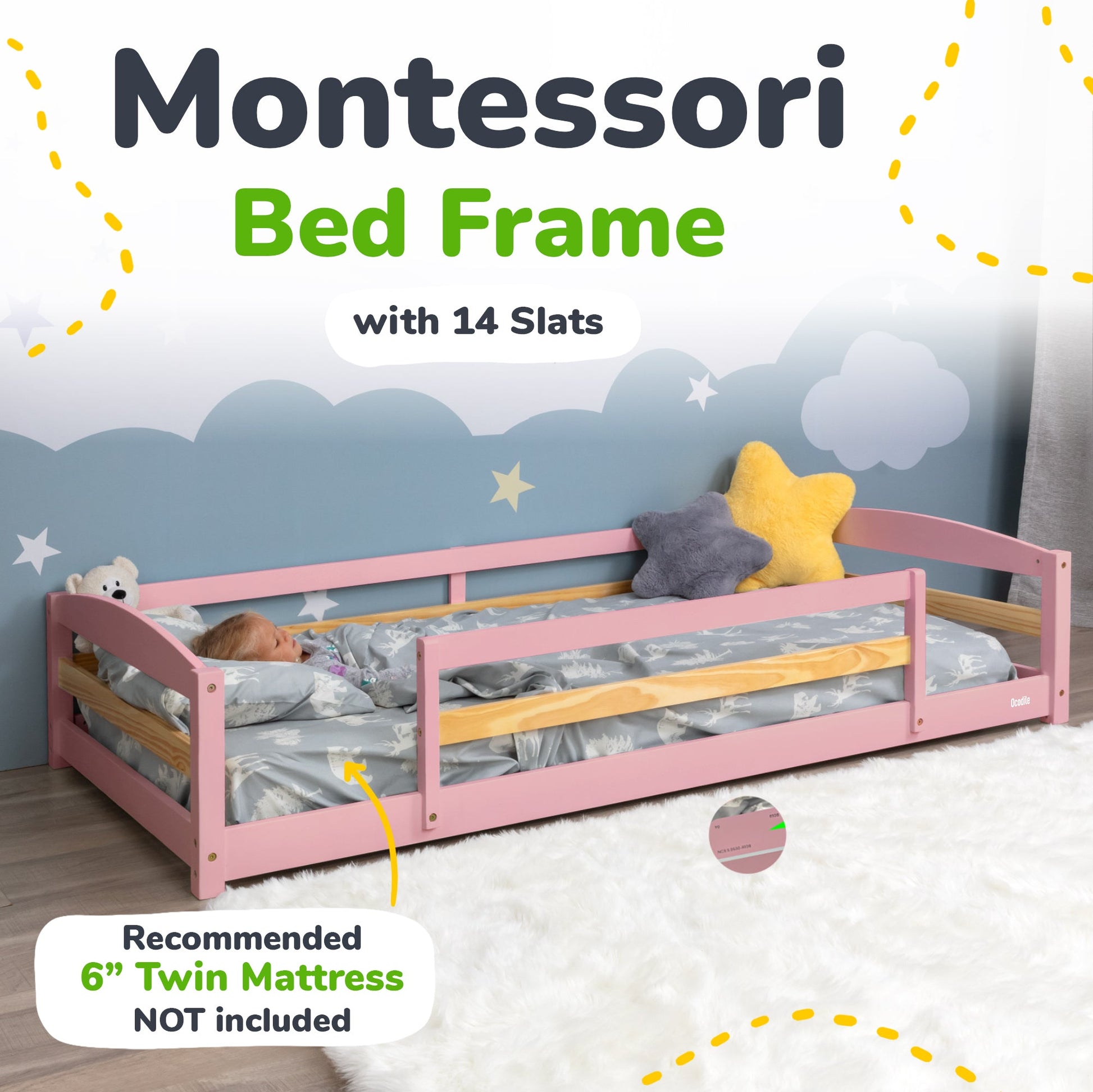 Pink Montessori bed frame with 14 slats and bedding, against a blue wall with cloud and star decorations.