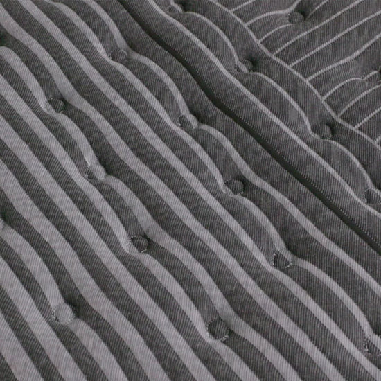 hand pressing on the beautyrest black series one extra firm mattress