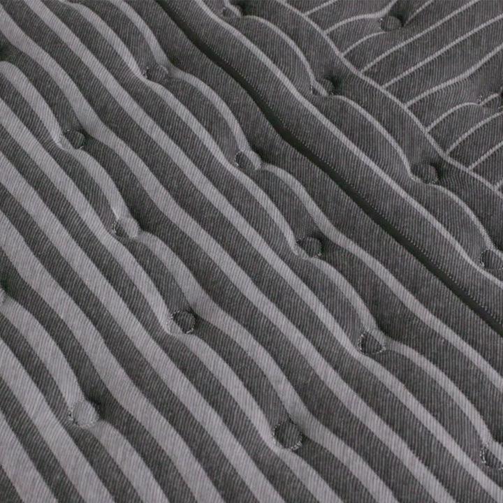 hand pressing on the beautyrest black series one extra firm mattress