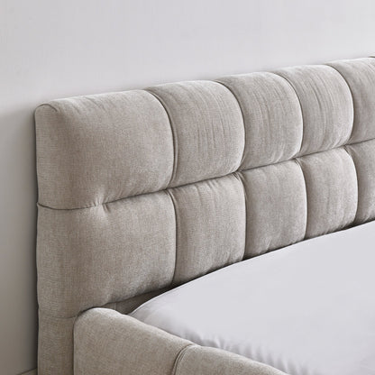Close-up of a chinelle beige headboard against a white wall.
