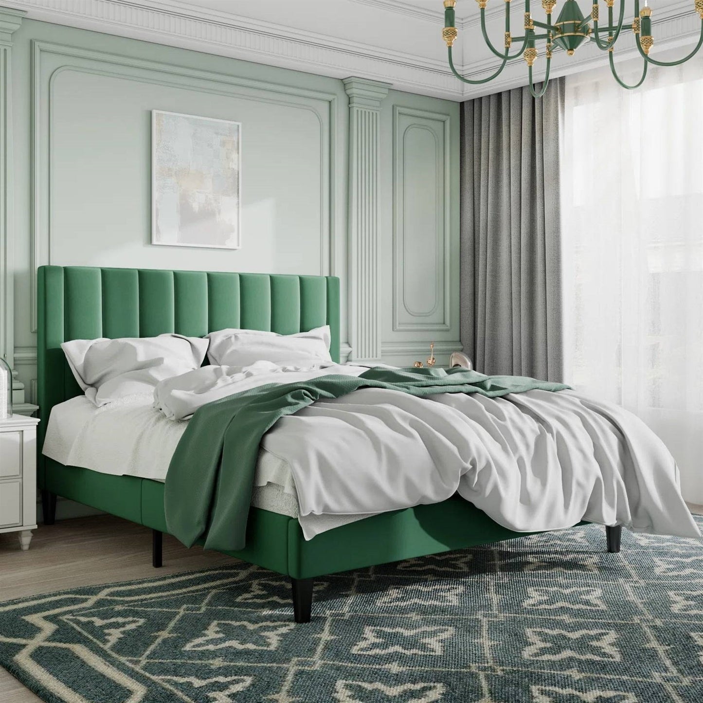 Queen size green velvet upholstered bed frame in a stylish bedroom with light green walls and a chandelier.