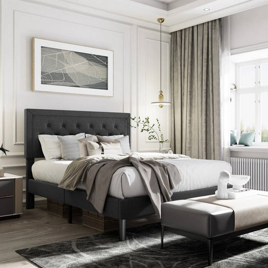 Black queen tufted bed frame in modern bedroom with luxury bedding