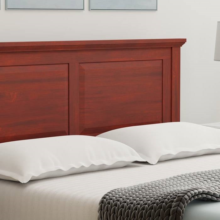 Queen size oak wood headboard for bed frame and white pillows and bedding with a gray throw blanket