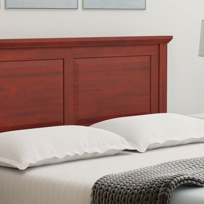 Queen size oak wood headboard for bed frame and white pillows and bedding with a gray throw blanket