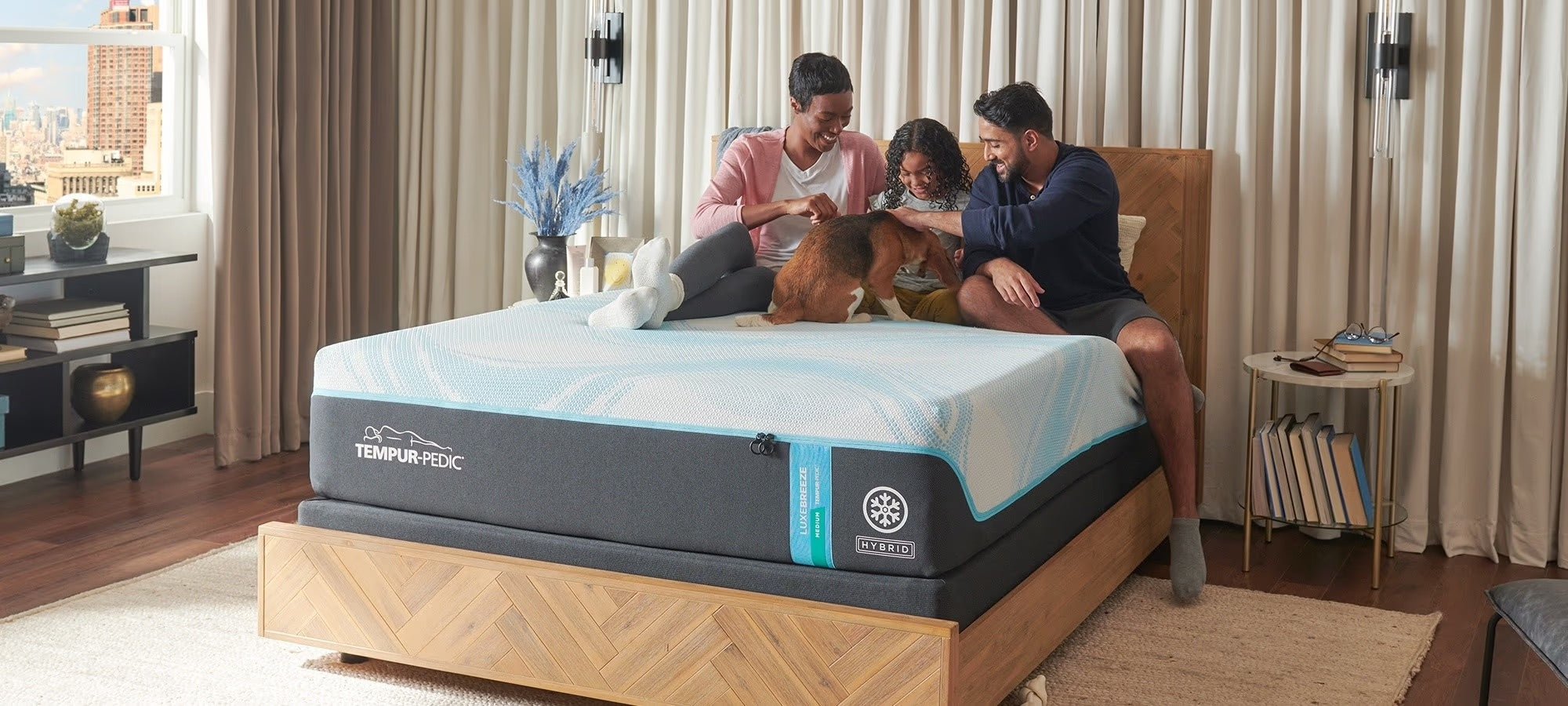 The best place to buy a tempurpedic - family in modern room on tempurpedic luxe breeze medium hybrid - on sale now at Sleep City