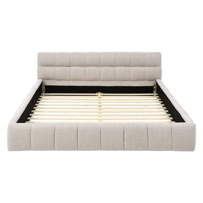 Beige upholstered bed frame with wooden slats on a white background