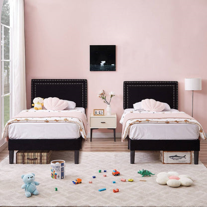 Two luxury black bed frames in pretty pink kids room