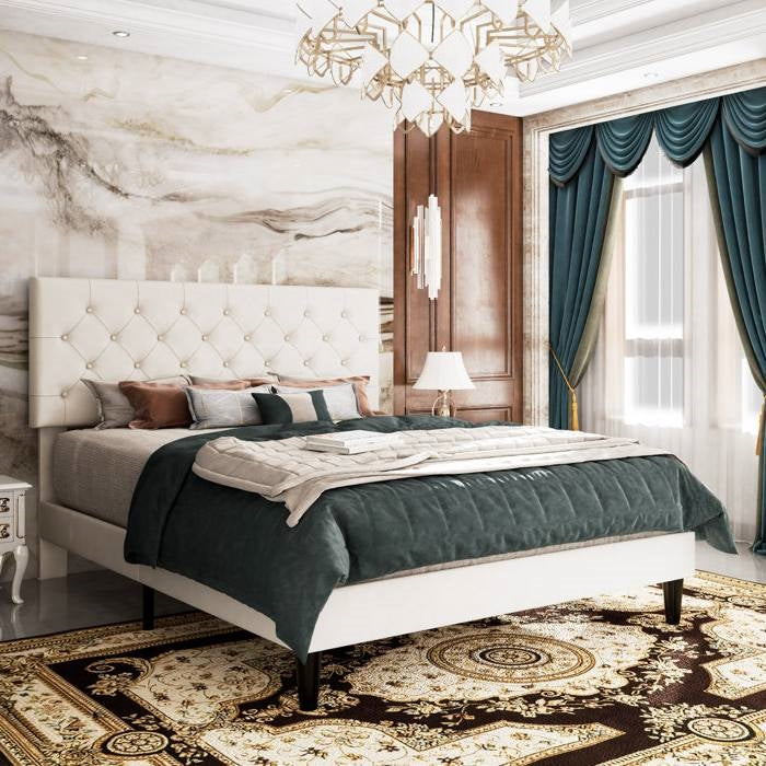 Luxurious bedroom with marble walls, a full size white leather platform bed, and decorative elements.