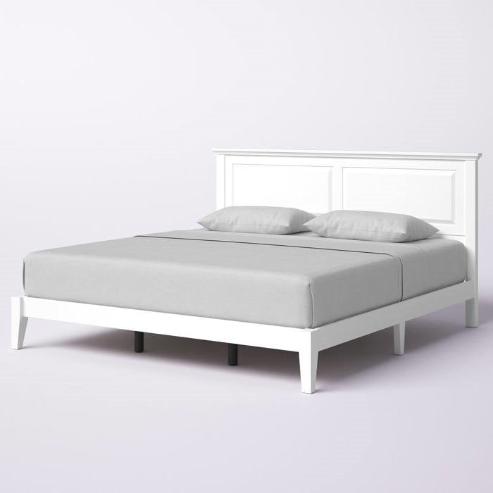 White king size wood oak bed frame with gray bedding on a white background