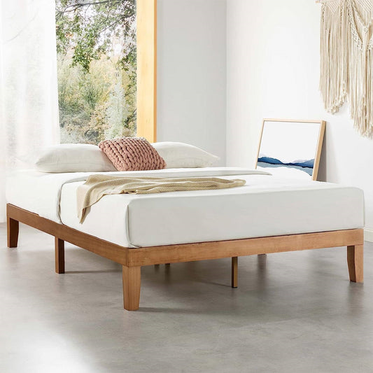 Cal king wooden platform bed frame with white mattress and pillows in a bright room.