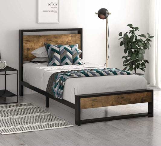 Bedroom with a metal and wooden platform bed frame, white bedding, and decorative pillows.
