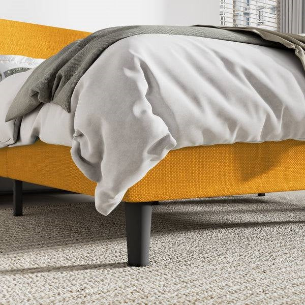 King size yellow platform bed frame with gray bedding